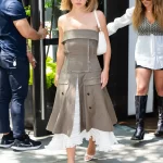 Sydney Sweeney draag bandeaujurk
