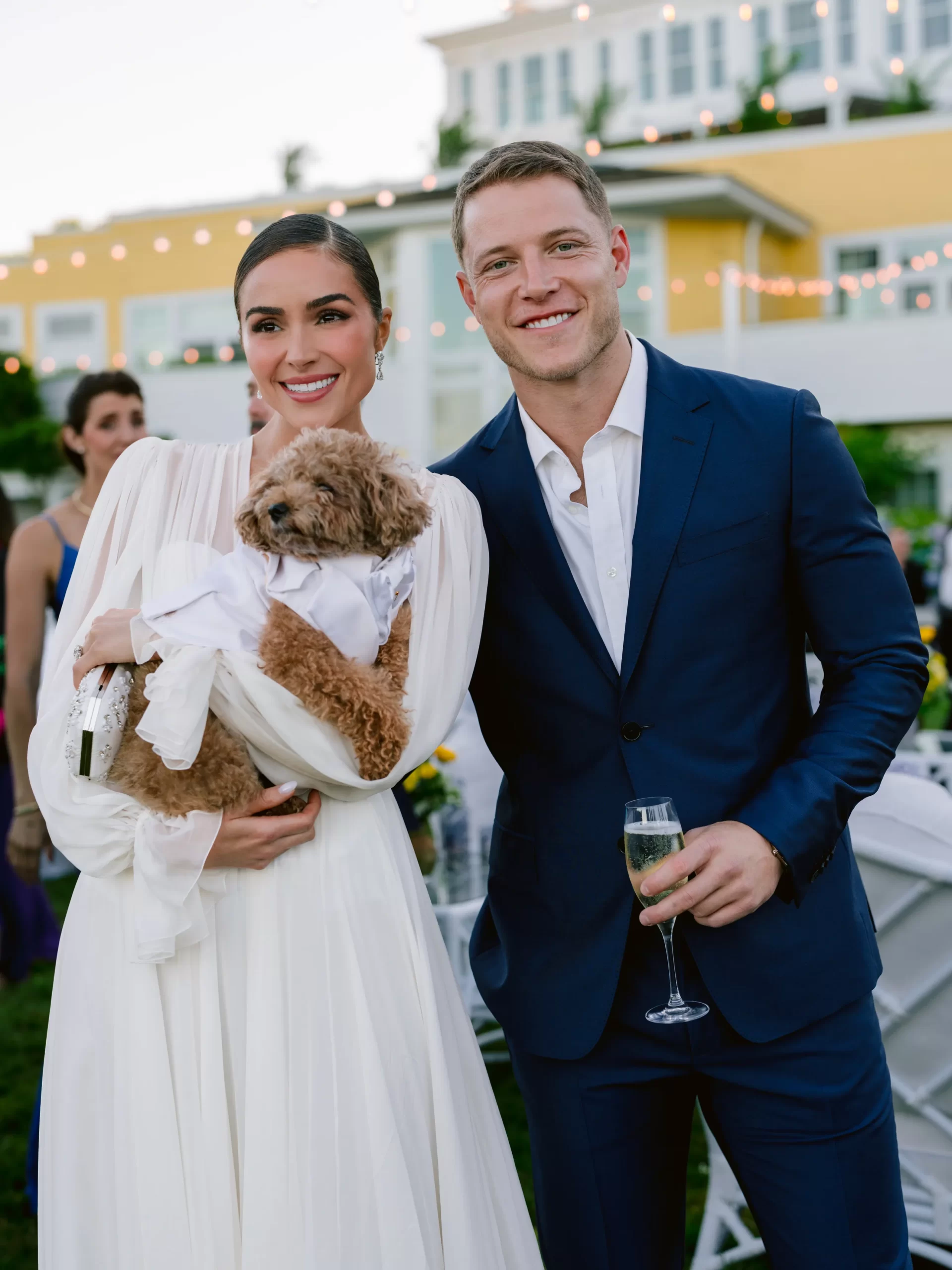 Olivia Culpo en Christian McCaffrey op hun bruiloft