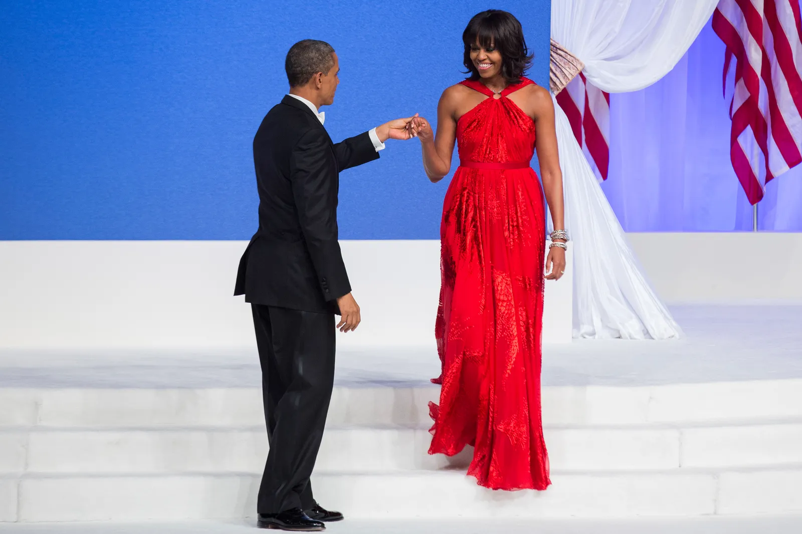 Michelle Obama, in een jurk van Jason Wu, met Barack Obama in 2013.