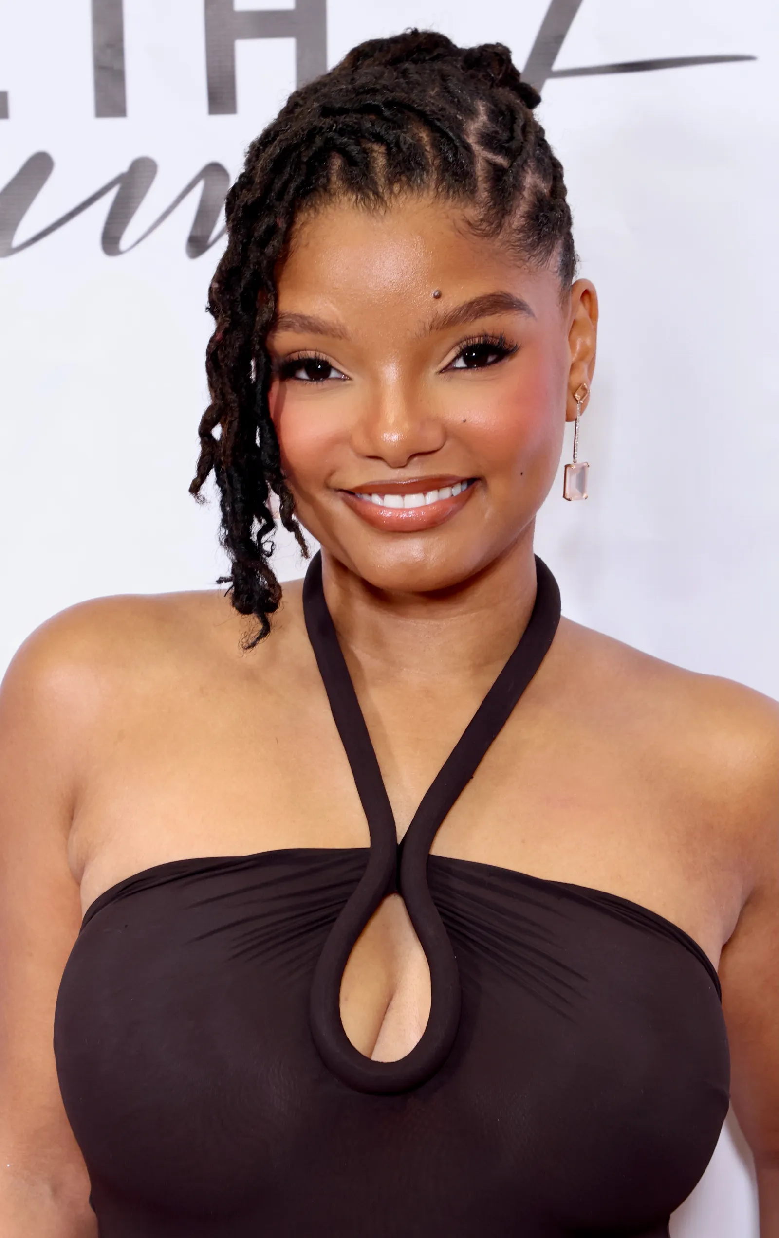 Halle Bailey met short locs