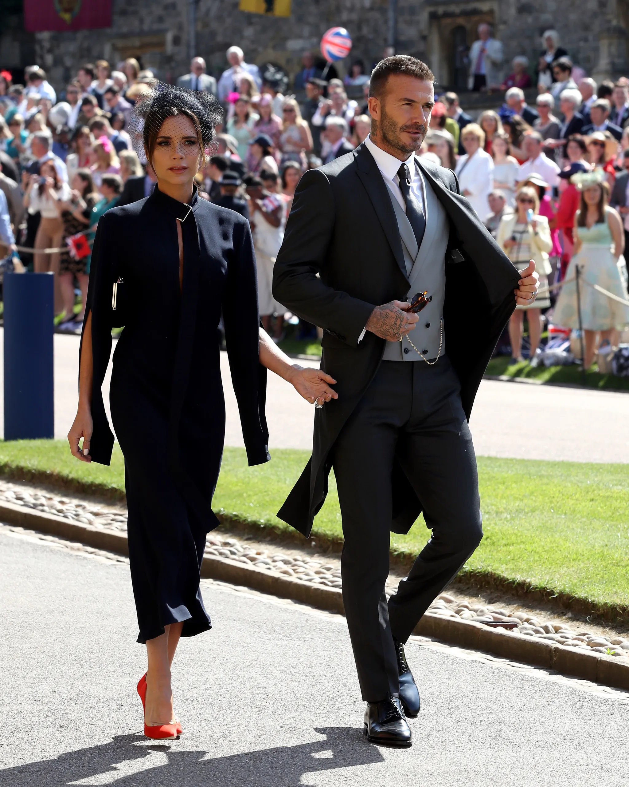 Victoria en David Beckham tijdens de bruiloft van Meghan en Harry
